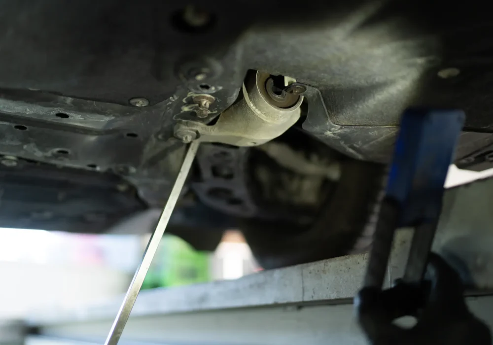 car-service-technician-checking-undercoat-of-car-2023-11-27-04-57-38-utc