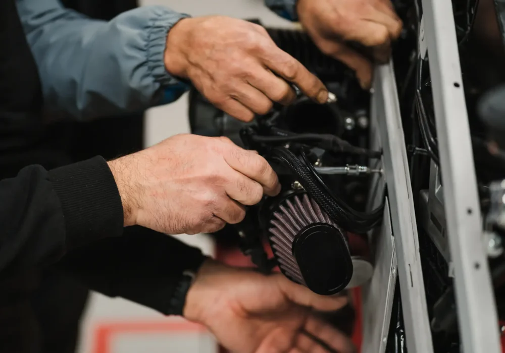 man-fixing-a-motorcycle-in-a-modern-workshop-2023-11-27-04-57-20-utc