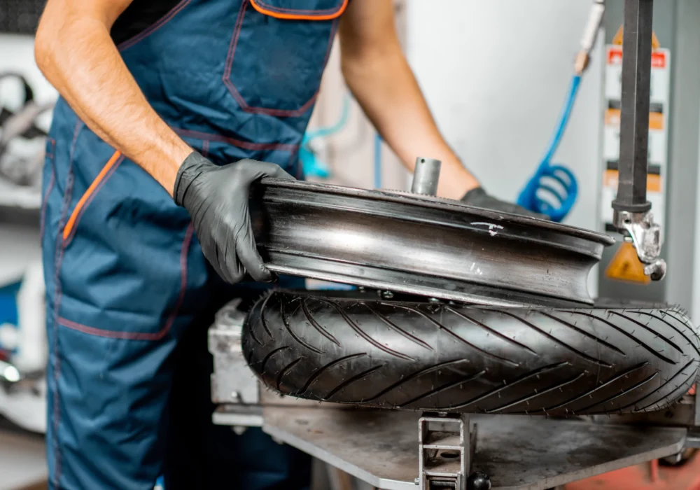 worker-changing-a-motorcycle-tire